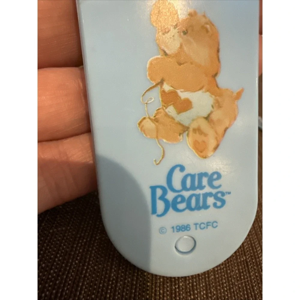 Vintage 1986 TCFC Care Bears LOVE ALOT BEAR Light Blue Folding Comb w/ Lanyard‎